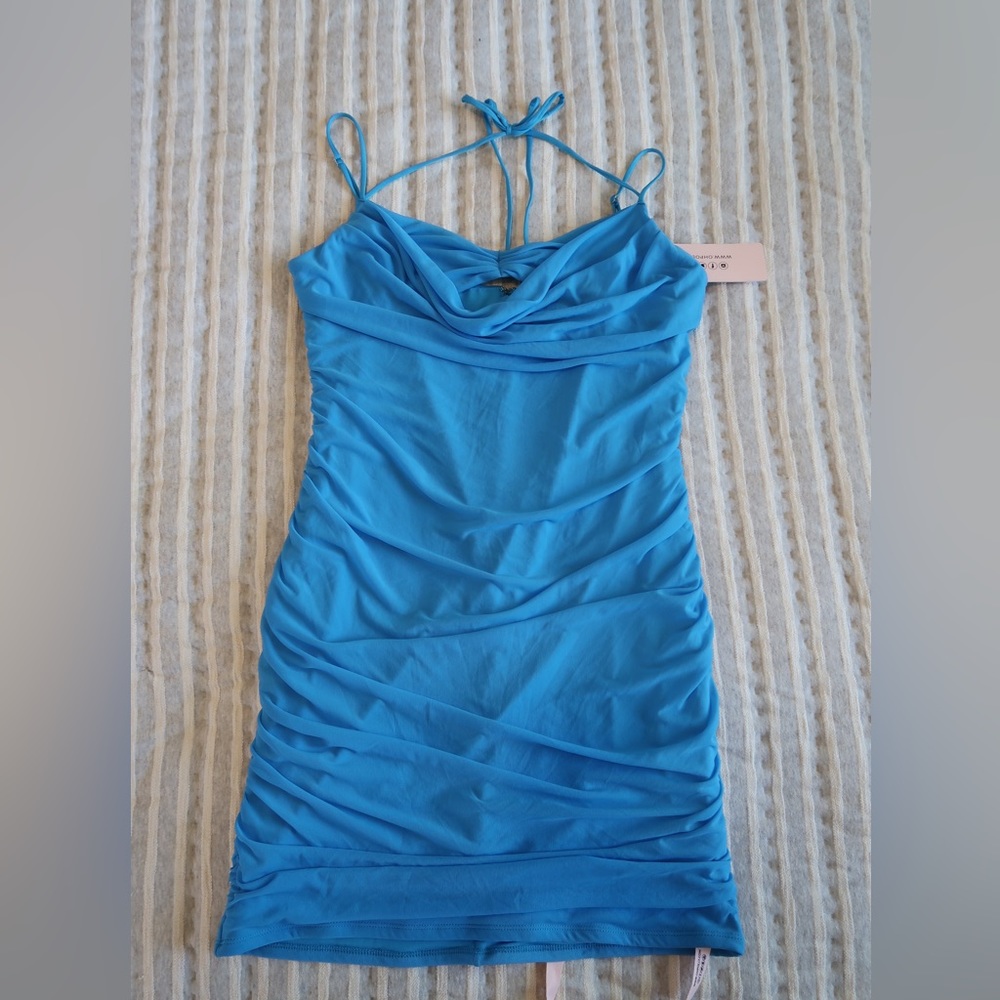 Oh Polly mini dress with adjustable straps and a halter tie detail🩵